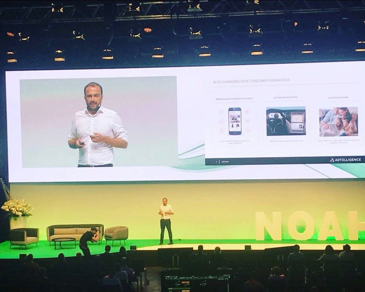 Michael Altendorf delivering keynote at NOAH Conference Berlin with Adtelligence on screen